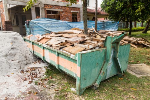 Secure enclosed skip placed on a construction site in Beckenham